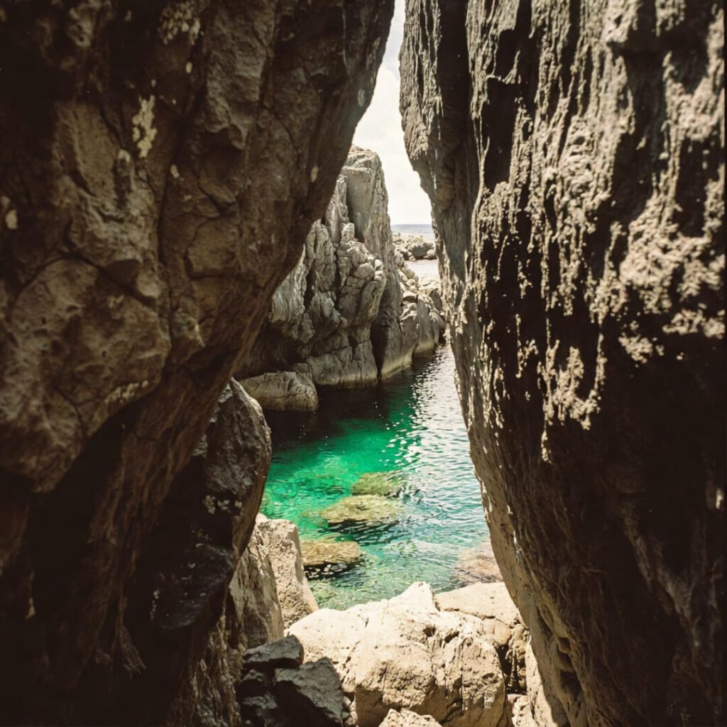 Hidden rock passage to secluded Australian beach.