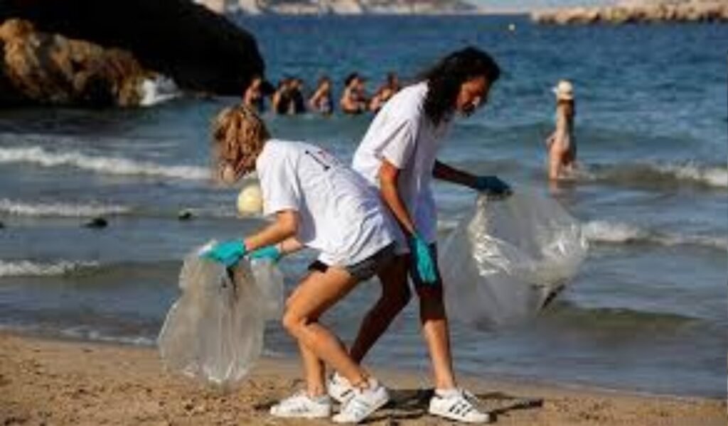 My quick beach cleanup during eco-friendly beach travel – grabbing trash to keep it green.