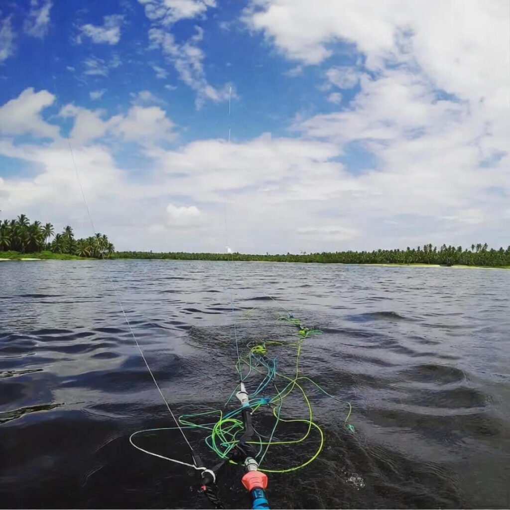 Tangled kite lines after crash in empty Asian lagoon.