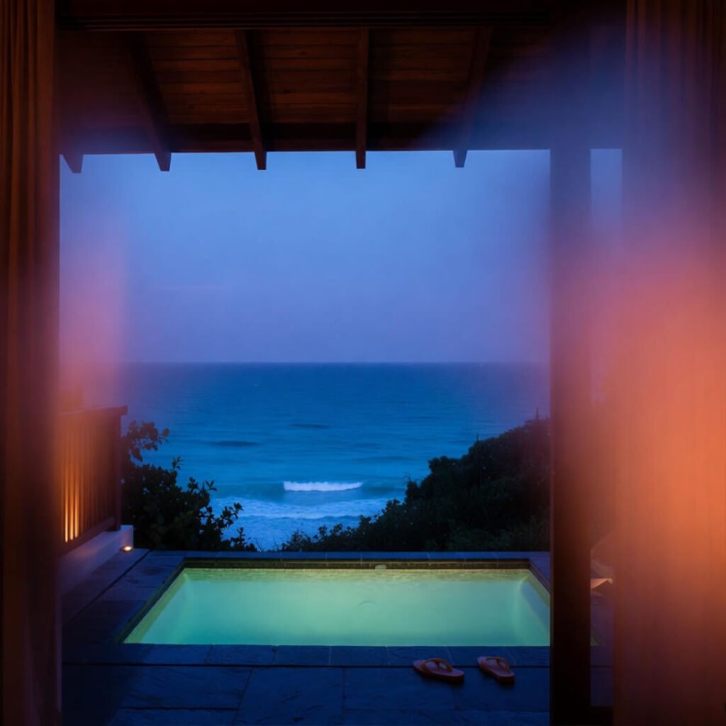 Private villa plunge pool overlooking turquoise ocean.