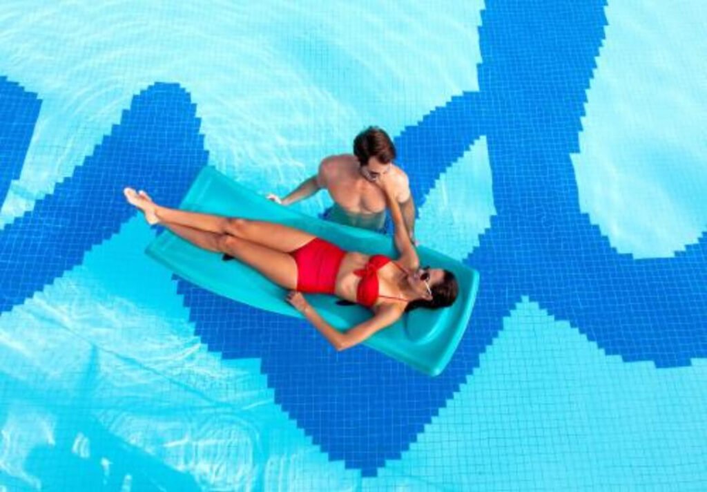 Relaxed (but kinda messy) pool scene at affordable all-inclusive beach resort under $1000