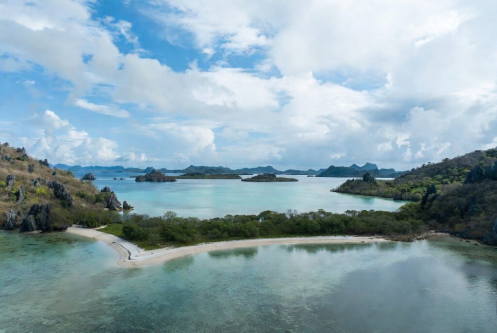 This image highlights the difference between Maldives and a Philippines island, showing similar natural beauty with a major cost difference in 2026.